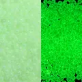 Luminous green glass bubble beads for DIY crafts showing day and night glow effect. - Green