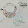 Fine moonlight aurora nail powder #05 showing iridescent shimmer on clear and tea base - Stars (zqsp1054-05)