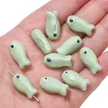 Light green fish-shaped ceramic beads for DIY jewelry making, bracelets and necklaces - Little Fish (BCD017) / 2 Pieces/Pack (10x19mm) / Light Green
