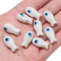 Small white ceramic fish beads with blue evil eye patterns for DIY jewelry making - Little Fish (BCD017) / 2 Pieces/Pack (10x19mm) / White