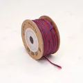 Hand-twisted red and blue cotton thread on a brown cardboard spool for DIY jewelry crafts - Palace Purple