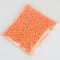 Small orange foam beads used as DIY craft material and gift box filler decoration - Approx. 900 Pieces / 5-10mm / Orange Red