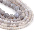 Macro detail of weathered stone beads with unique natural crackle texture patterns. - 21cm / 6mm / Gray Weathered