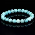 Detailed view of a turquoise beaded bracelet featuring natural stone texture and veins - Natural Turquoise