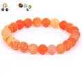 Detailed view of orange weathered stone beads featuring unique natural crackle textures - 21cm / 6mm / Weathered Orange