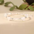Detailed view of handmade bracelet with white heart shells and silver metallic beads. - White (Heart Shell Style)