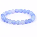 Close-up of light blue weathered stone beads with unique natural crackle textures - 21cm / 6mm / Light Blue Weathered