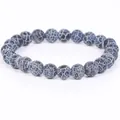 Macro detail of weathered stone beads showing intricate white crackle patterns - 21cm / 6mm / Black Weathered Stone