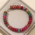 Detailed macro view of colorful 5x8mm natural stone abacus bead bracelet on display tray - 17cm + Tail Chain / Colorful Tourmaline Jade