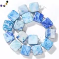 Detail view of 10mm blue square jade beads with natural marble texture - 10mm (16-17 Pieces) / Sky Blue