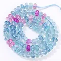 Detailed close-up macro view of 5x8mm translucent blue and purple crystal abacus beads for DIY - 5x8mm Approx 77-82 Pieces / Aura Lake Blue