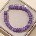 Detailed shot of purple natural stone abacus bead bracelet with silver heart charm - 17cm + Tail Chain / Light Amethyst Jade