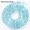 Detailed view of translucent light blue 5x8mm crystal rondelle beads for jewelry making - 5x8mm Approx 77-82 Pieces / Lake Blue