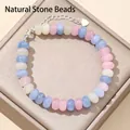 Close-up of 5x8mm abacus beads bracelet featuring natural pastel stones and silver heart charm - 17cm + Tail Chain / Morganite