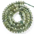 Detailed view of translucent green 5x8mm abacus crystal beads for jewelry making - 5x8mm Approx 77-82 Pieces / Dark Green