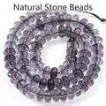 Macro detail of 5x8mm smoky purple crystal abacus beads with natural ice crackle textures. - 5x8mm Approx 77-82 Pieces / Black and Gray