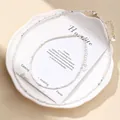 Macro detail of faceted white howlite bead necklace set on elegant display with card - Necklace And Anklet Set / Howlite