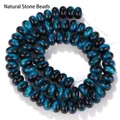Nahaufnahme von blauen Tigerauge-Glas-Abakus-Perlen mit glänzendem Katzenaugen-Effekt - 5x8mm Abakusperlen (ca. 75-80 Stück) / Saphirblau