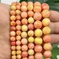 Perle tonde in pietra naturale marmorizzata arancione e gialla per creazione gioielli - Arancione