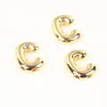 Detailed view of 20mm gold copper letter C beads with a shiny balloon-like texture. - Letter C / 2 Pcs/Set