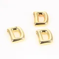 Close-up of shiny gold-plated copper letter D beads for DIY jewelry and necklaces. - Letter D / 2 Pcs/Set