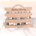 Detaillierte Ansicht des Naturstein-Armbandsets mit Moosachat- und Zebra-Jaspis-Perlen - Baumachat