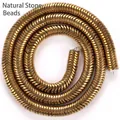 Detailed view of 6mm golden wave-shaped hematite spacers for DIY jewelry making. - Glossy Wave Spacer / 6x6x1mm / Gold