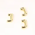 Detailed close-up view of three 20mm golden copper letter J beads for DIY jewelry - Letter J / 2 Pcs/Set