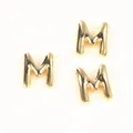 Detail shot of three puffy gold-toned copper letter M beads for DIY jewelry making - Letter M / 2 Pcs/Set