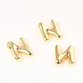 Macro detail of 20mm polished golden copper alphabet letter N beads for DIY pendants - Letter N / 2 Pcs/Set