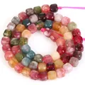 Dettaglio di perle cubiche sfaccettate in tormalina naturale multicolore per gioielli - Cubo Sfaccettato / 5mm / Multicolore