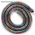Macro view of 6mm rainbow metallic wave-shaped hematite beads for DIY jewelry making. - Glossy Wave Spacer / 6x6x1mm / Multicolor