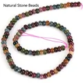 Vista dettagliata di perle tonde in tormalina naturale colorata per gioielli fai da te - perline di abaco / 4x6mm / Multicolore