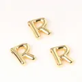 Macro detail of golden balloon-style letter R copper charms for DIY jewelry making - Letter R / 2 Pcs/Set