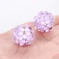 Close-up of purple bubble beads with rhinestones for DIY jewelry making. - Purple
