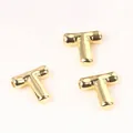 Close-up detail of 20mm gold copper T-shaped letter beads for DIY jewelry making. - Letter T / 2 Pcs/Set