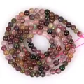 Primo piano di perle tonde in tormalina naturale multicolore per gioielli fatti a mano - Perline rotonde / 3-3.5mm / Colorato
