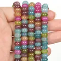 Vista ravvicinata di perline di tormalina multicolore in pietra naturale per gioielli fai-da-te - Stile Perline Abaco / 5x8mm / Colorato