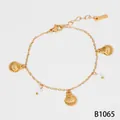 Fashionable gold stainless steel bracelet featuring seashell charms and white pearls - Gold (B1065)