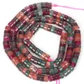 Primo piano di perle cilindriche in tormalina naturale per la creazione di gioielli - Distanziatori / 4x2mm / Multicolore Scuro