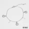 Elegant silver stainless steel ocean style bracelet featuring shell charms and pearls - Silver (B1065)