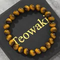 Premium round tiger eye style glass beaded bracelet displayed on a black gift box - 19cm 8mm / Yellow