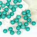 Close-up of vibrant synthetic turquoise round beads for DIY jewelry making - 12mm Round / 10 Pack