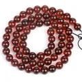 Nahaufnahme von polierten rotbraunen Naturbernsteinperlen für DIY-Schmuck - 6mm (ca. 60 Stück) / Blutbernstein