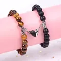 Detail view of magnetic heart couple bracelets with tiger eye and matte black beads. - Black and White Heart Magnetic Style / 19cm (8mm Beads) / Matte Black Yellow Tiger Eye