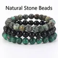 Set di 3 bracciali in pietre naturali con perline verdi macchiate e nere lucide. - Onice Nero + Turchese Africano + Rubino Zoisite / 21cm (Perle da 8mm)