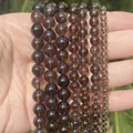 Vista macro comparativa de cuentas de cuarzo ahumado de 4 mm a 12 mm para crear joyería - Smoky Quartz Round Beads / 4mm (Aprox. 88 piezas) / Marrón Té
