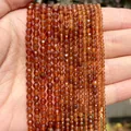 Detailed view of faceted brownish-red natural stone beads used for DIY jewelry making. - 2mm Approx 170 Pieces / Coffee Agate