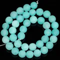 Detailed view of matte Amazonite turquoise stone beads for DIY jewelry crafting - Approximately 36 / 10mm / Light Blue