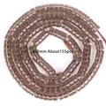 Detalle macro de cuentas cilíndricas de cuarzo ahumado de 4x2mm para joyería DIY, 155 unidades. - Smoky Quartz Abacus Beads / 4x2mm (Aprox. 155 piezas) / Marrón Té